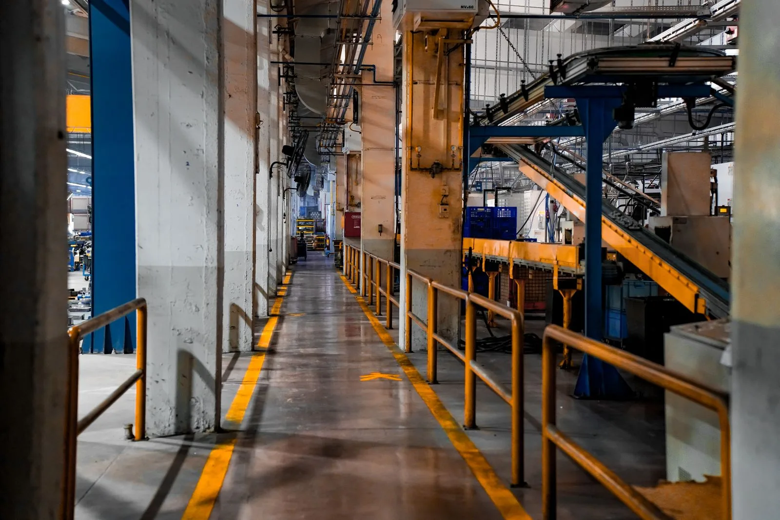 Safety manager conducting a workplace inspection on a plant floor