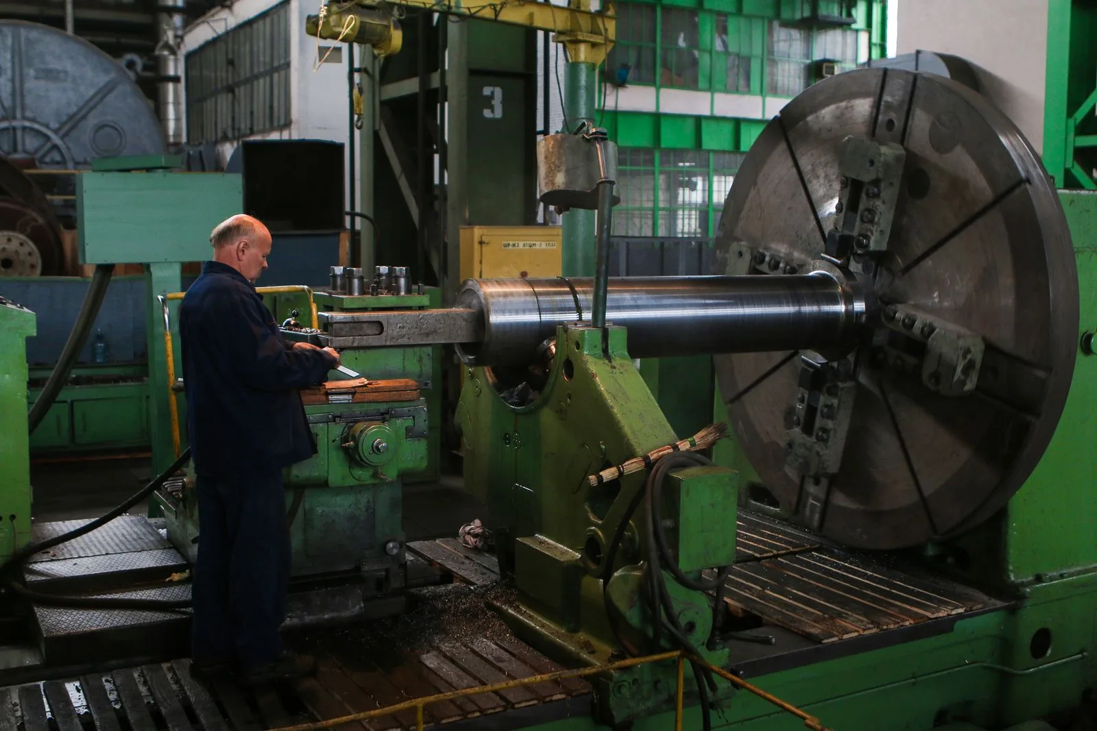 Operations manager reviewing production performance on a plant floor